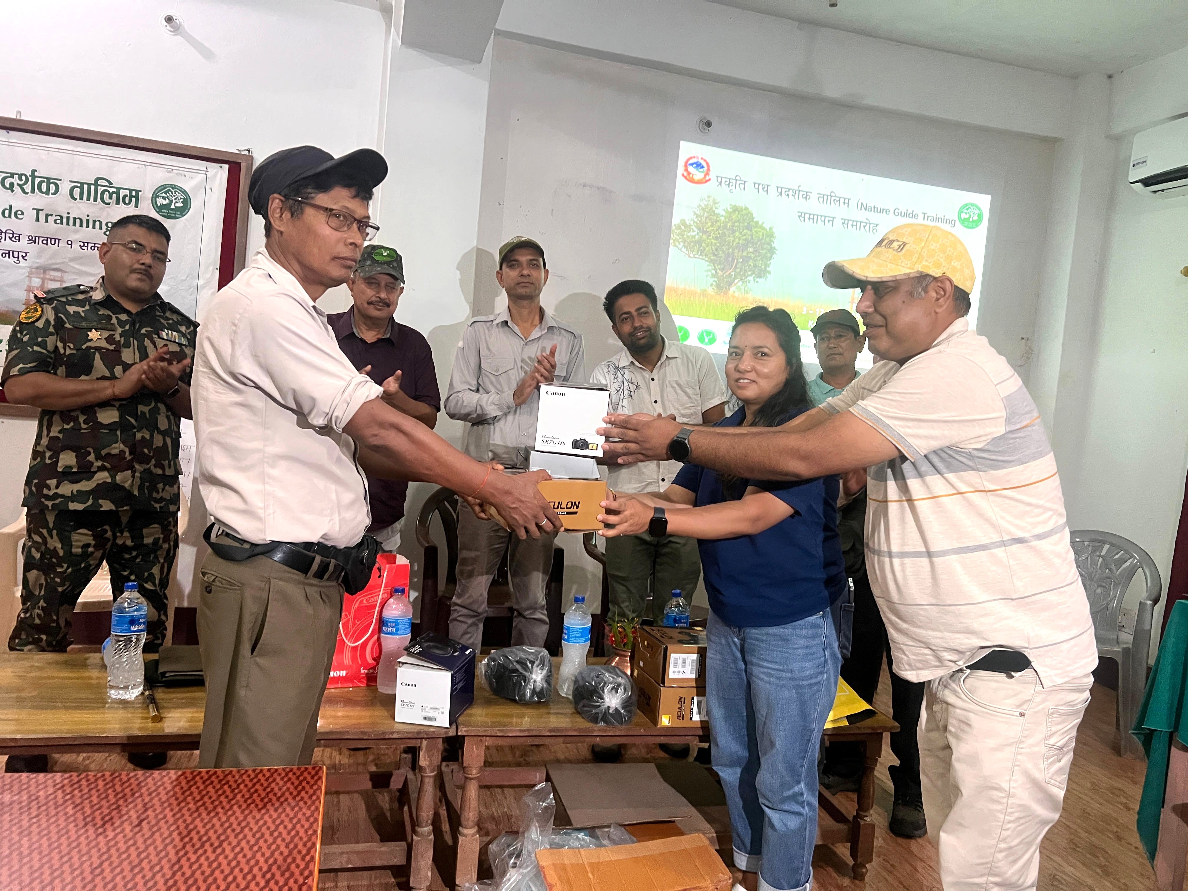 Handovering 3 set of Binocular, 1 GPS and 2 digital camera to Natures Guide Association Shuklaphanta  17th  July 2025, Pic Manju