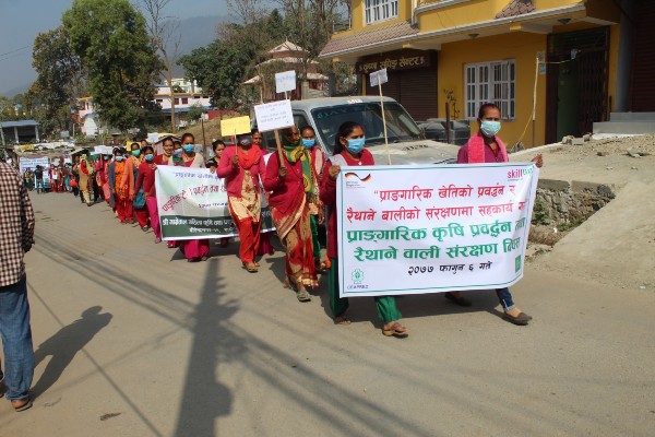 Skill Up!  Farmers’ Field School participants in the rally holding banner of go-green slogans