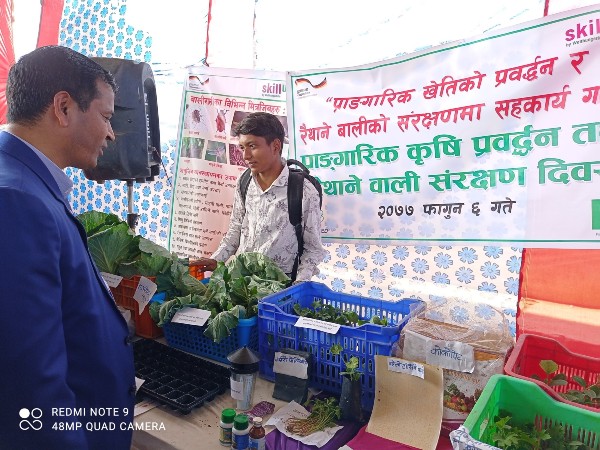 Chief Minister of Karnali Province observing green products displayed by Skill Up project at its stall visiting Skill Up! Stall