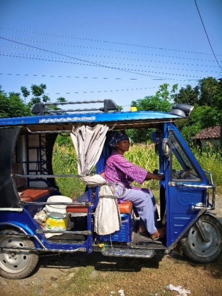Babli with her newly purchased auto for transporting vegetables to market